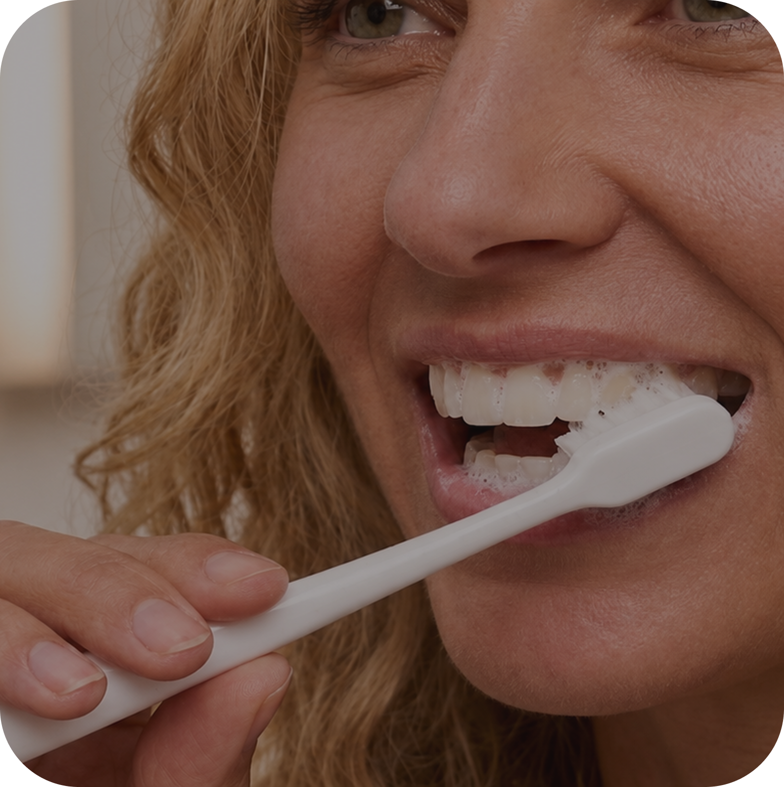 Woman brushing with Nano Toothbrush